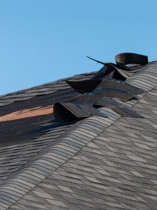 wind damaged shingle roof