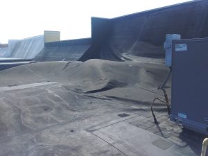 wind damaged EPDM roof