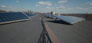 Medium shot of solar panels on flat roof
